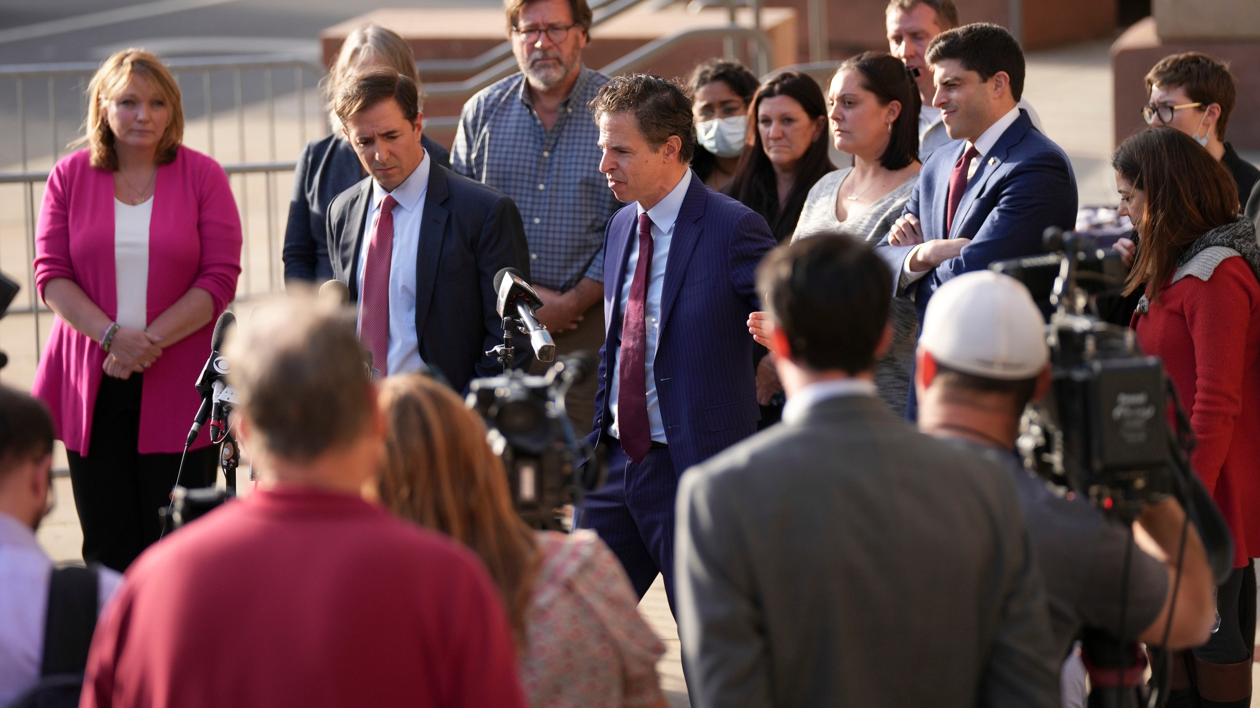 FILE - The lawyers representing the families of the victims of the shooting at Sandy Hook Elementary speak to the media after jurors returned a $965 million dollar judgement in the defamation trial against Alex Jones, in Waterbury, Conn, Oct. 12, 2022. Jones asked the court Wednesday, June 5, 2024, for permission to convert his personal bankruptcy reorganization to a liquidation, which would lead to a sell-off of a large portion of his assets to help pay some of the $1.5 billion he owes relatives of victims of the shooting. (AP Photo/Bryan Woolston, File)