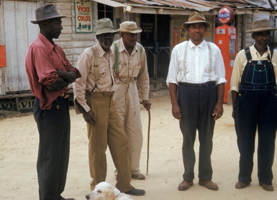 In this 1950's file photo released by the National Archives, men included in a syphilis study pose for a photo in Tuskegee, Ala. Most Black Americans are likeliest to say that they experience racial discrimination regularly and that such experiences inform how they view major U.S. institutions, according to a new study from the Pew Research Center released Monday, June 10, 2024. The study seeks to highlight the country's documented racist history against Black people as a possible explanation for why Black Americans hold conspiratorial views about major U.S. institutions. (National Archives via AP)