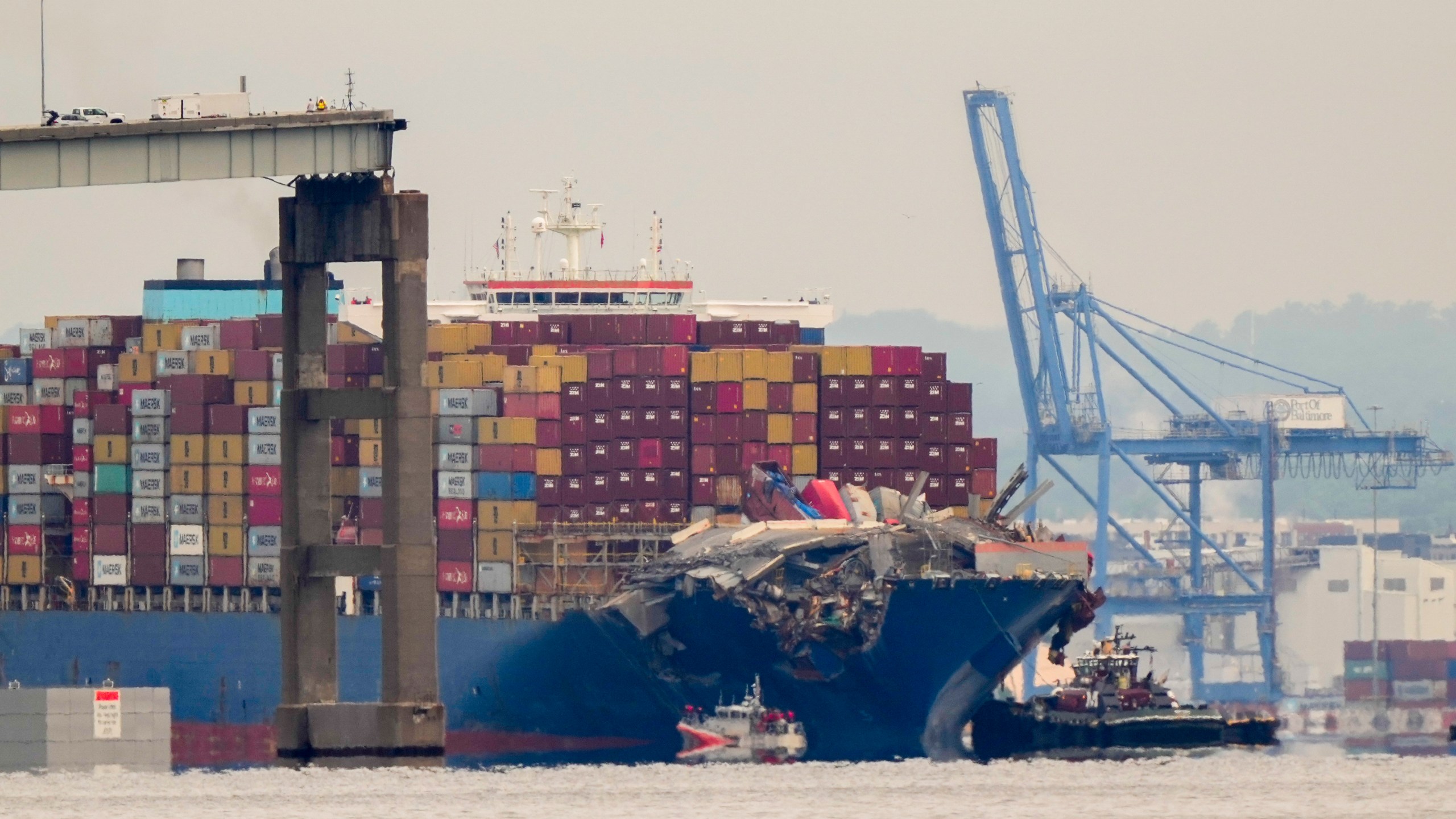 Tugboats escort the cargo ship Dali after it was refloated in Baltimore, Monday, May 20, 2024. The vessel struck the Francis Scott Key Bridge on March 26 causing it to collapse and resulting in the death of six people. (AP Photo/Matt Rourke)