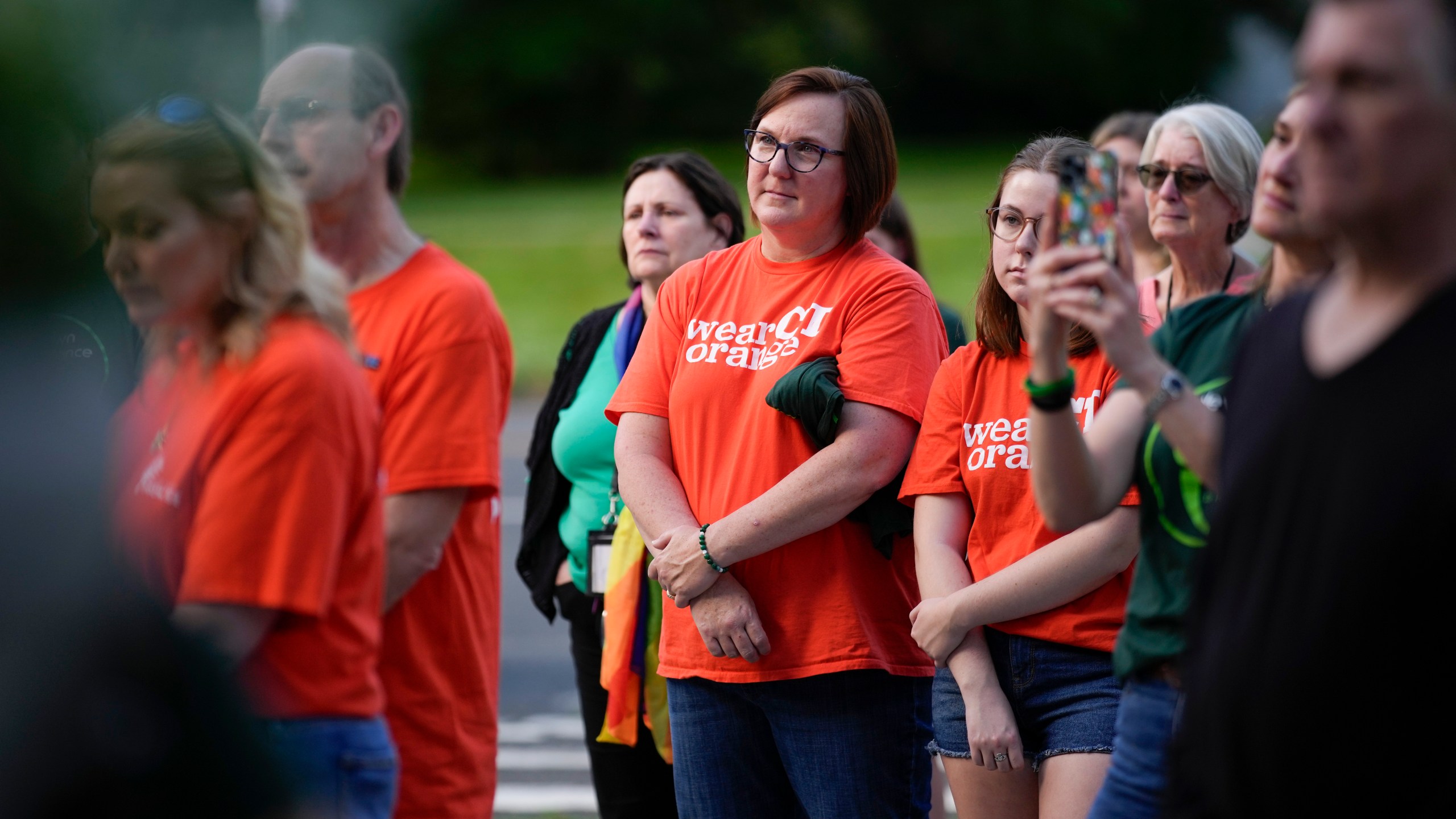 Local residents join survivors of the 2012 Sandy Hook Elementary School shooting for a rally against gun violence on Friday, June 7, 2024 in Newtown, Conn. (AP Photo/Bryan Woolston)