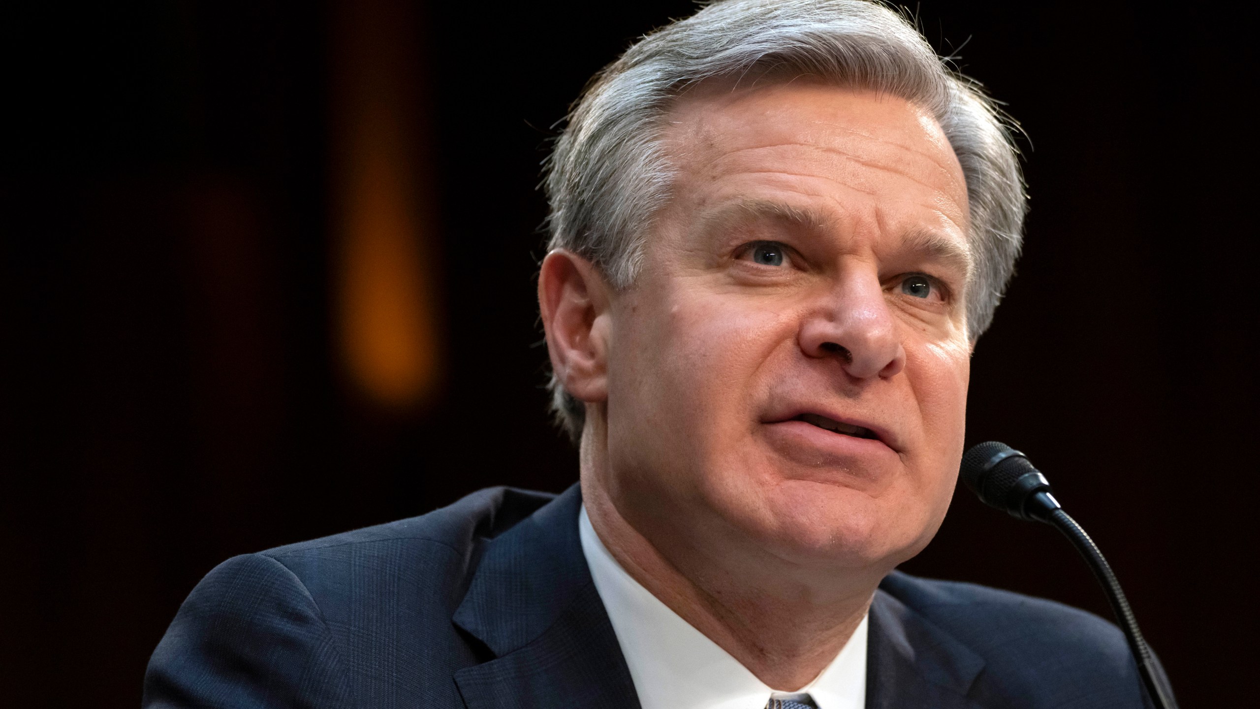 FBI Director Christopher Wray speaks during a hearing of the Senate Intelligence Committee on Capitol Hill, March 11, 2024, in Washington. Eight individuals from Tajikistan with suspected ties to the Islamic State have been arrested in the United States in recent days. (AP Photo/Mark Schiefelbein, File)