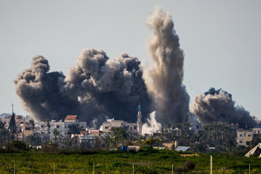 FILE - Smoke and explosion following an Israeli bombardment inside the Gaza Strip, as seen from southern Israel, Sunday, Feb. 11, 2024. The latest proposal for a cease-fire in Gaza has the support of the United States and most of the international community, but Hamas has not fully embraced it, and neither, it seems, has Israel. (AP Photo/Ariel Schalit, File)