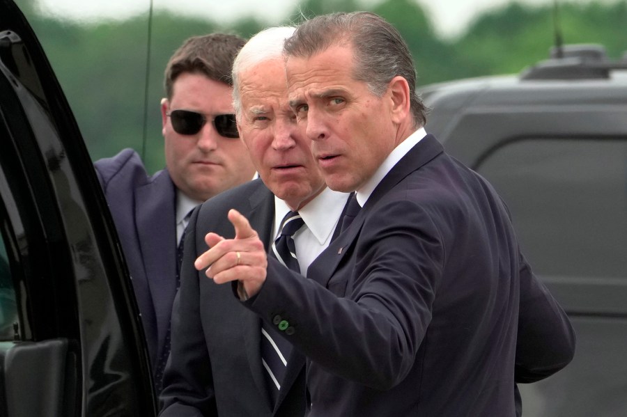 President Joe Biden talks with his son Hunter Biden as he arrives Delaware Air National Guard Base in New Castle, Del., Tuesday, June 11, 2024. (AP Photo/Manuel Balce Ceneta)