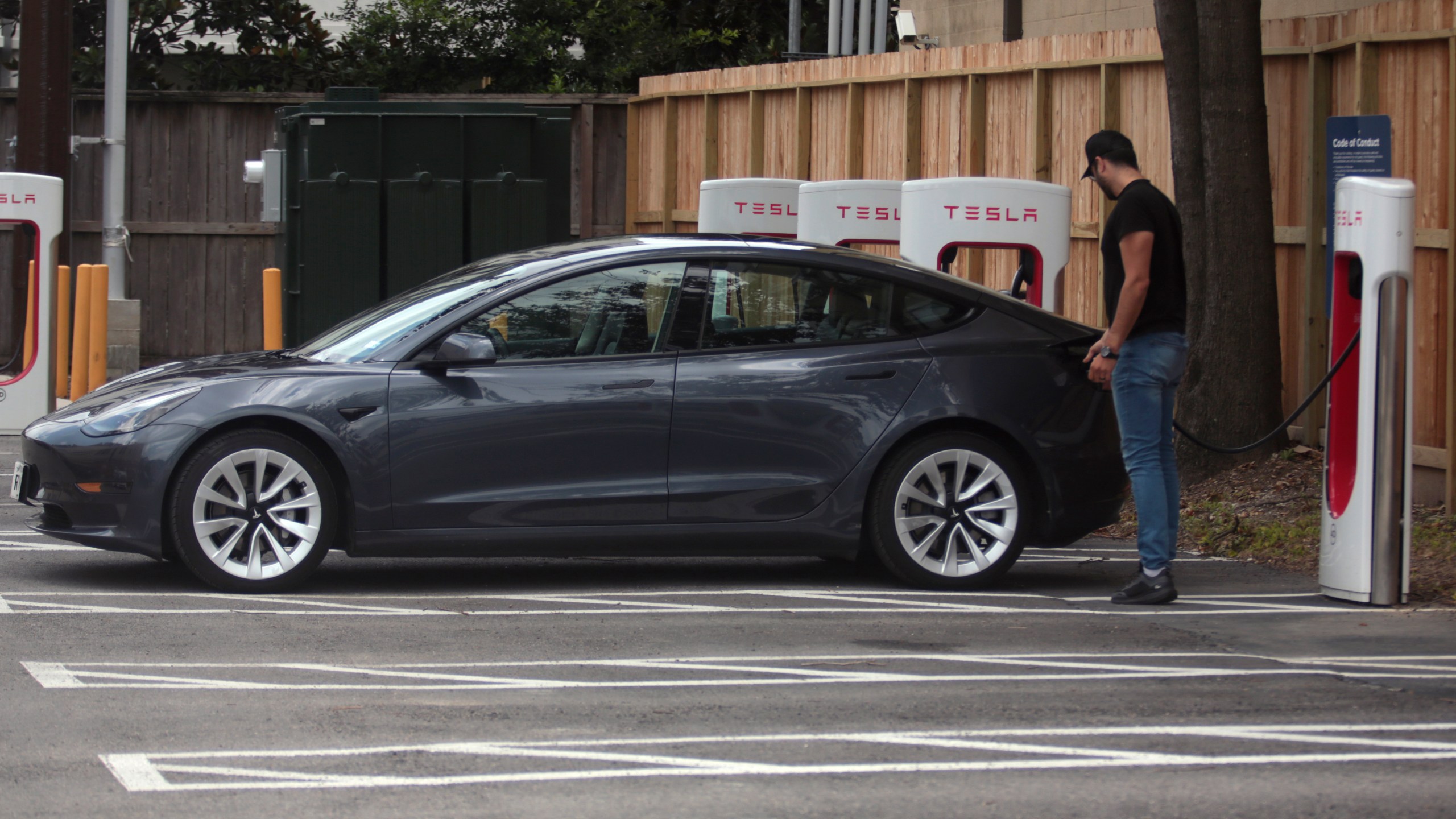 A Tesla supercharging location is seen on Kipling Street, June 3, 2024 in Houston. Charging stations have been hit particularly hard by thieves who likely want to sell the highly conductive copper wiring inside the cables at near-record prices. But authorities and charging company officials say similar thefts are increasing across the U.S. as more charging stations are built. (AP Photo/Lekan Oyekanmi)