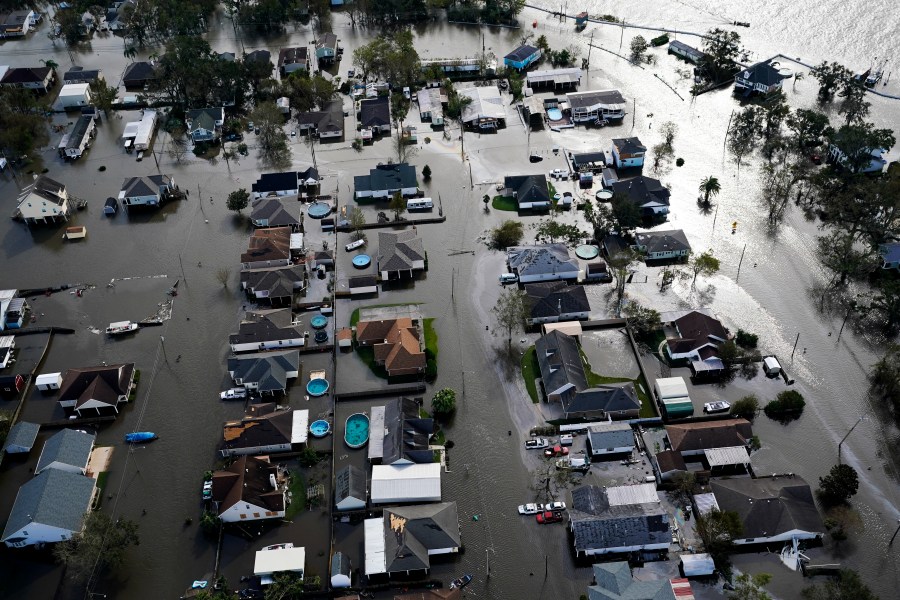 FILE - Homes are flooded in the aftermath of Hurricane Ida, Aug. 30, 2021, in Jean Lafitte, La. The National Oceanic Atmospheric Administration Thursday, June 13, 2024, pronounced dead the El Nino that warms parts of the central Pacific. Forecasters expect La Nina to breeze in just in time for peak Atlantic hurricane season. (AP Photo/David J. Phillip, File)