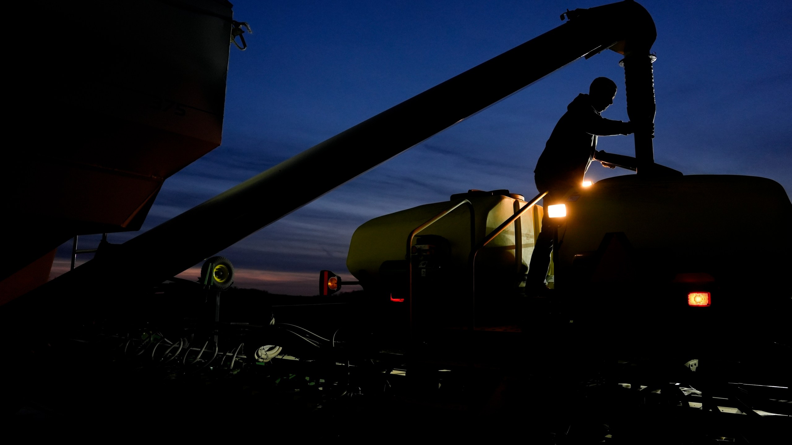 FILE - Mark Woodruff loads soybean seeds into a planter on April 22, 2024, in Sabina, Ohio. On Thursday, June 13, 2024, The labor department releases producer prices data for May. (AP Photo/Joshua A. Bickel, File)