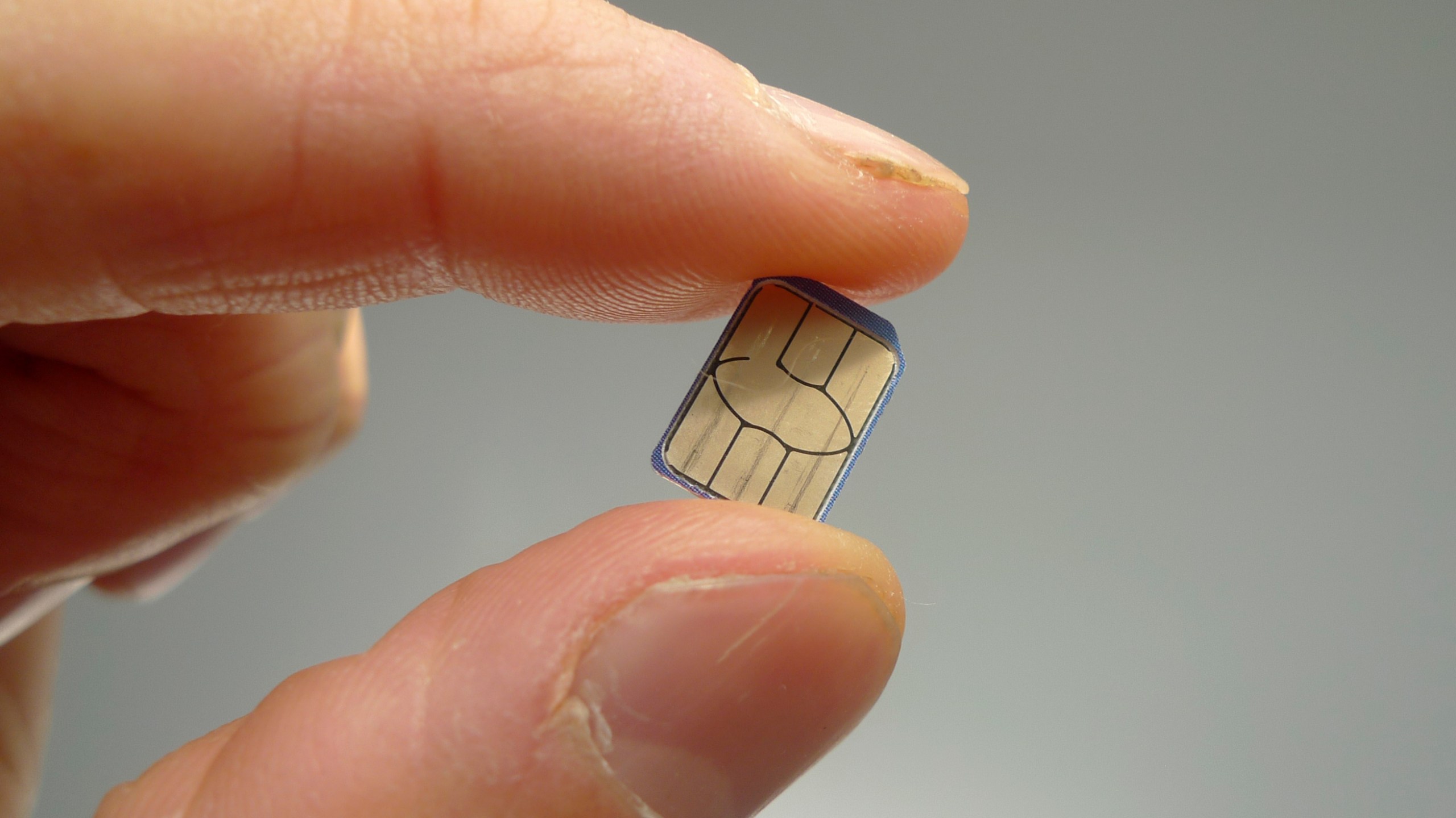 A SIM card is shown in this photo taken on Monday, June 10, 2024 in London. Physical SIM cards are going away, replaced by eSIMs which make switching cell carriers easier. AP Photo/Kelvin Chan)