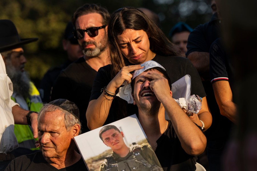 FILE - Relatives mourn during the funeral of Israeli Staff Sergeant Shay Arvas at the Holon military cemetery, outskirts of Tel Aviv, Israel, on Nov. 2, 2023. A proposed cease-fire deal between Israel and Hamas is the latest serious attempt to wind down the war, and while it still faces significant hurdles, negotiations meant to bring it to fruition are ongoing. (AP Photo/Bernat Armangue, File)