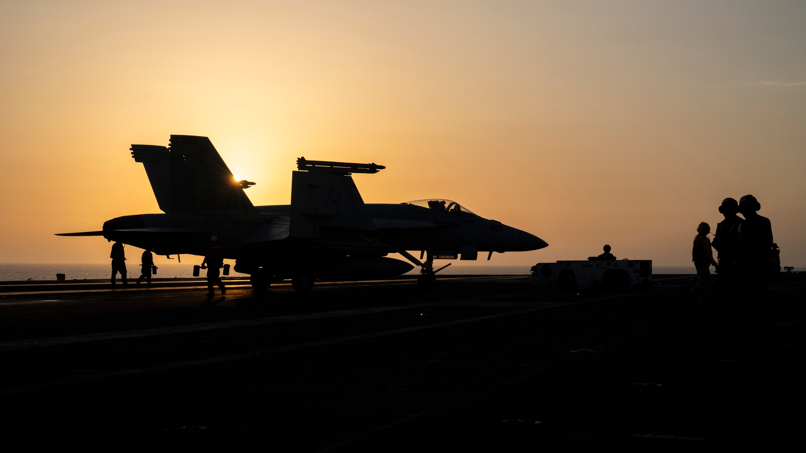 A fighter jet parks on the deck of the USS aircraft carrier Dwight D. Eisenhower, also known as 'IKE', in the Red Sea, Tuesday, June 11, 2024. (AP Photo/Bernat Armangue)