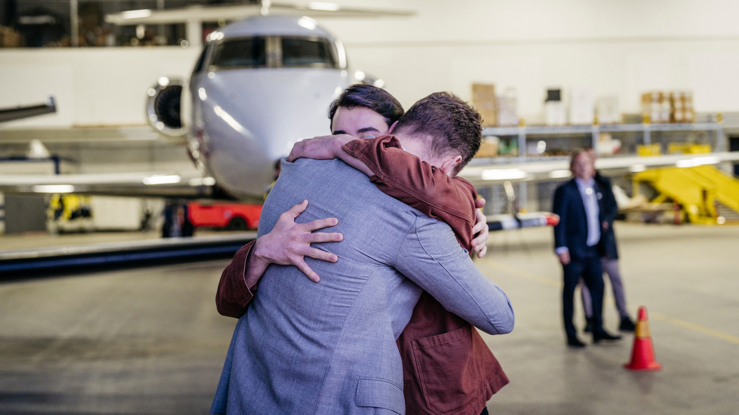 In this photo provided by the Swedish government, Johan Floderus reunites with his family at Arlanda airport in Stockholm, Sweden on Saturday, June 15, 2024, after being released from prison in Iran. (Tom Samuelsson/Swedish government/TT News Agency via AP)