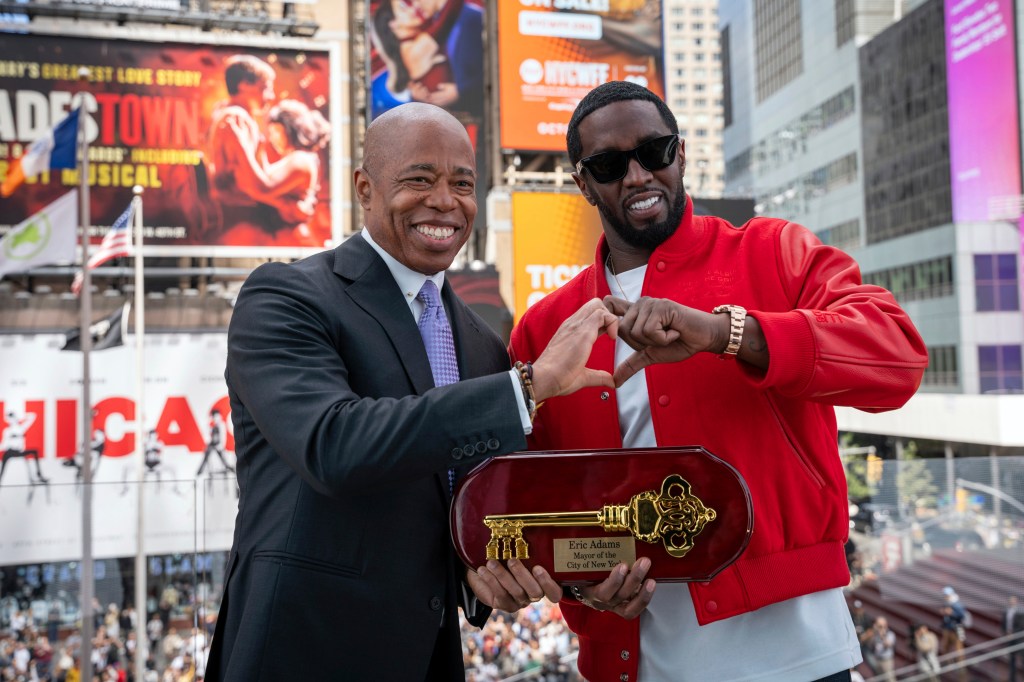 FILE - This photo provided by the Office of the New York Mayor, shows Mayor Eric Adams, left, presenting the Key to the City to hip-hop artist Sean "Diddy" Combs in New York's Times Square, Friday, Sept. 15, 2023. Combs has returned his key to New York City after a request from Adams in response to the release of a video showing the music mogul attacking R&B singer Cassie, officials said Saturday. (Office of the New York Mayor/Caroline Rubinstein-Willis via AP)