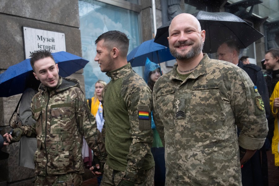 LGBT soldiers attend a Pride march in Kyiv, Ukraine, Sunday, June 16, 2024. Several hundred LGBT Ukrainian servicemen and other protesters joined a pride march in central Kyiv Sunday seeking legal reforms to allow people in same-sex partnerships to take medical decisions for wounded soldiers and bury victims of the war with Russia that extended across Ukraine more than two years ago. (AP Photo/Efrem Lukatsky)