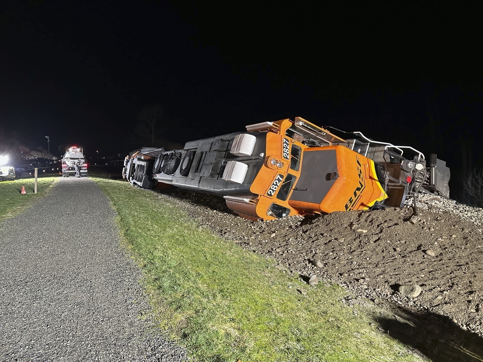 This photo provided by the Washington Department of Ecology shows a derailed BNSF train on the Swinomish tribal reservation near Anacortes, Wash. on March 16, 2023. A federal judge on Monday, June 17, 2024 ordered BNSF Railway to pay nearly $400 million to a Native American tribe in Washington state after finding that the company intentionally trespassed when it repeatedly ran 100-car trains carrying crude oil across its reservation. (Washington Department of Ecology via AP)