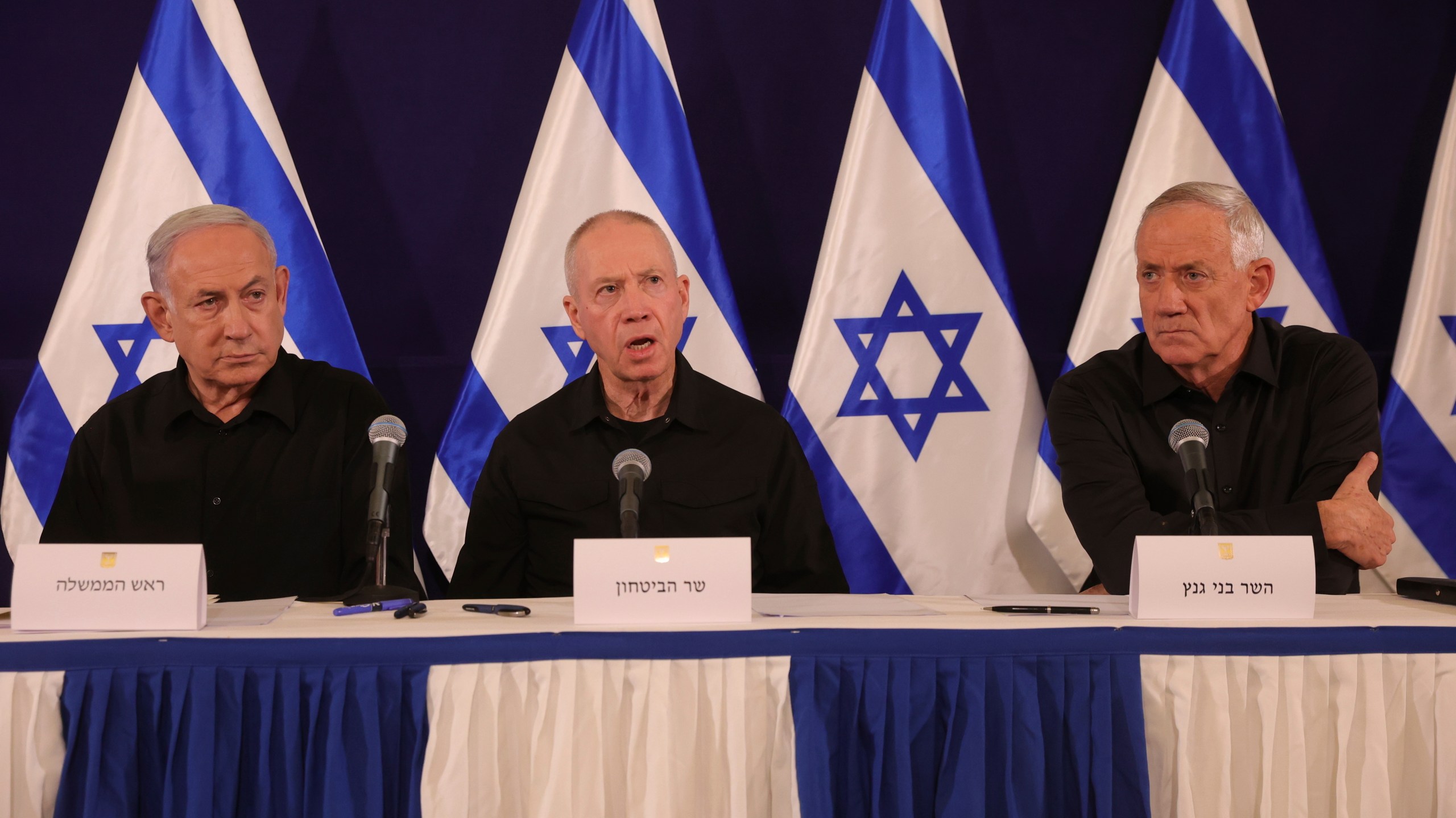 FILE - From left, Israeli Prime Minister Benjamin Netanyahu, Defense Minister Yoav Gallant and Cabinet Minister Benny Gantz speak during a news conference in the Kirya military base in Tel Aviv, Israel on Oct. 28, 2023. Israeli officials said Monday, June 17, 2024, that Netanyahu has dissolved the influential War Cabinet that was tasked with steering the war in Gaza. (Abir Sultan/Pool Photo via AP, File)