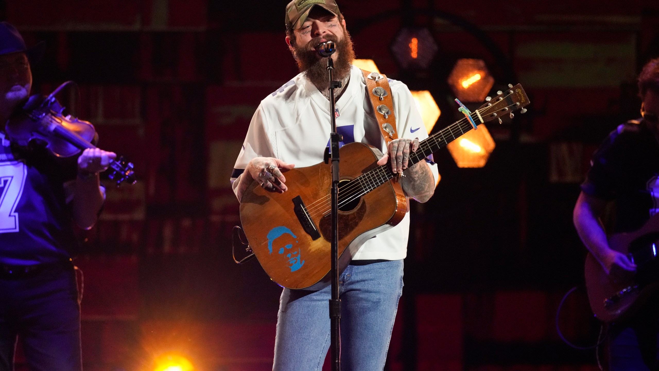 FILE - Post Malone performs a medley during the 59th annual Academy of Country Music Awards on Thursday, May 16, 2024, at the Ford Center in Frisco, Texas. Post Malone and Doja Cat, two of pop music’s biggest stars, will headline this year’s Global Citizen Festival in New York’s Central Park on Sept. 28, 2024, as organizers focus on mobilizing young people to help address the world’s pressing problems. (AP Photo/Chris Pizzello, File)