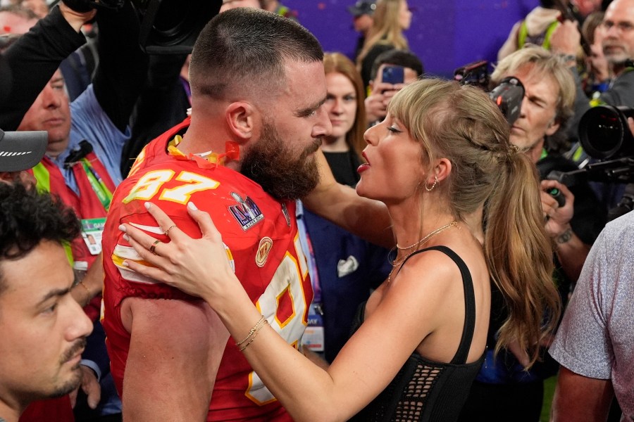 FILE = Kansas City Chiefs tight end Travis Kelce (87) speaks to Taylor Swift after the team's NFL Super Bowl 58 football game against the San Francisco 49ers, Feb. 11, 2024, in Las Vegas. A 170-year-old rivalry is flaring up as Kansas lawmakers try to snatch the Super Bowl champion Kansas City Chiefs away from Missouri. The team has international cache after three Super Bowl titles in five years and because of Kelce’s romance with pop icon Swift.(AP Photo/John Locher, File)