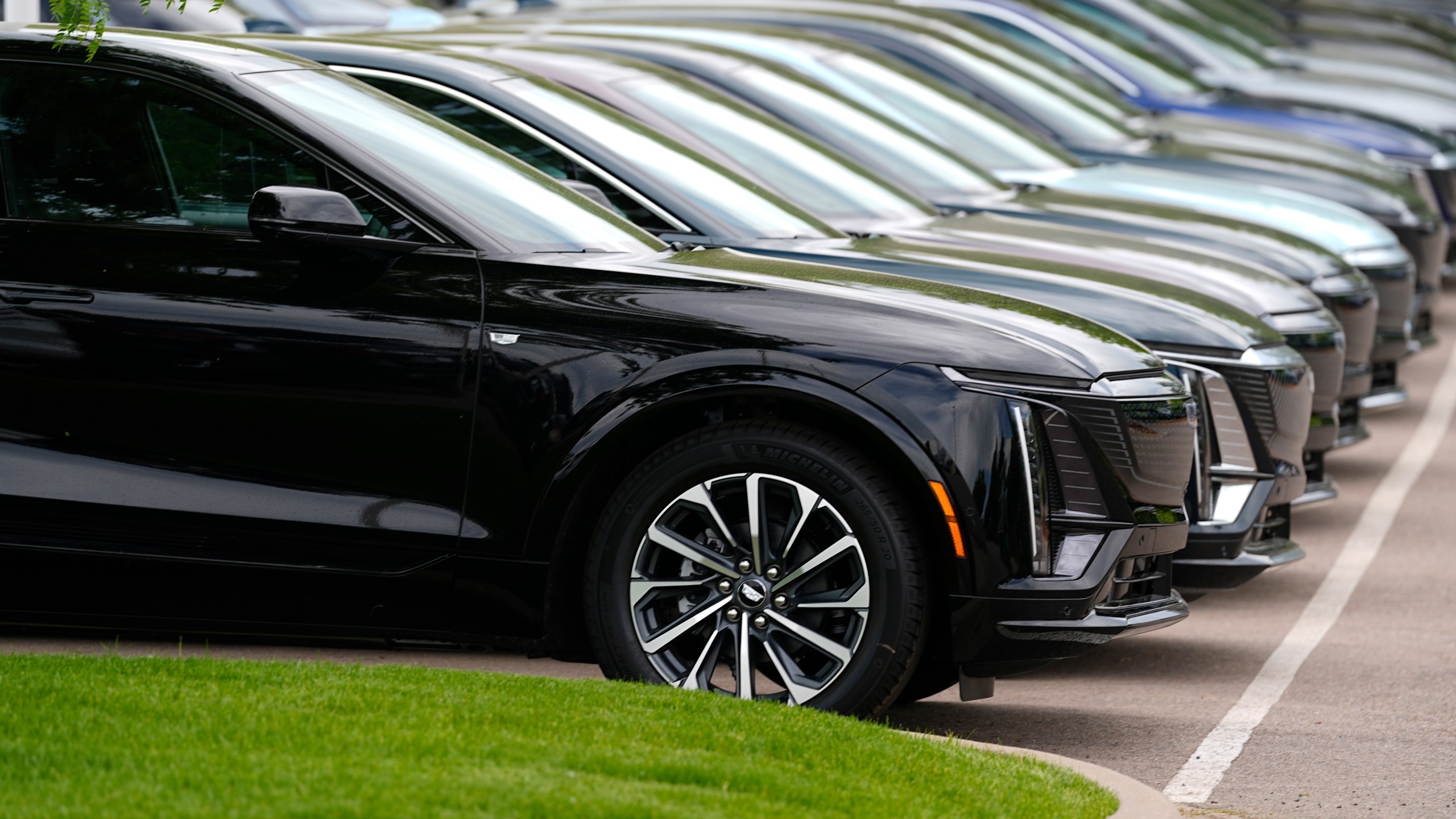 FILE - Vehicles sit in a row outside a dealership, June 2, 2024, in Lone Tree, Colo. Car dealerships across North America have faced a major disruption this week. CDK Global, a company that provides software for thousands of auto dealers in the U.S. and Canada, was hit by back-to-back cyberattacks on Wednesday, June 19, 2024. (AP Photo/David Zalubowski, File)