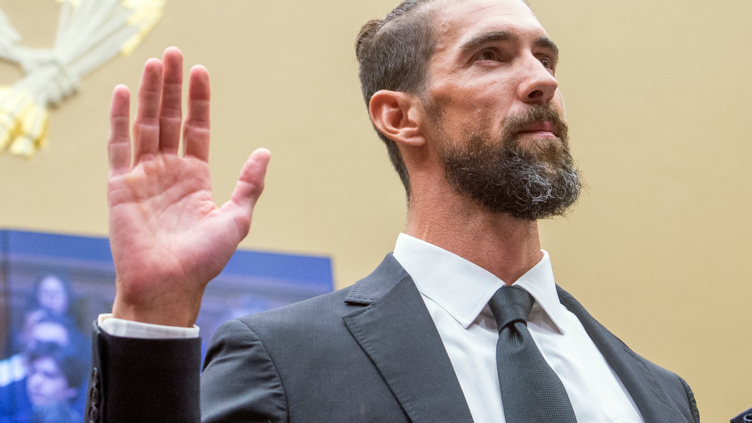 Michael Phelps, former Olympic athlete, is sworn in during a House Committee on Energy and Commerce Subcommittee on Oversight and Investigations hearing examining Anti-Doping Measures in Advance of the 2024 Olympics, on Capitol Hill, Tuesday, June 25, 2024, in Washington. (AP Photo/Rod Lamkey, Jr.)