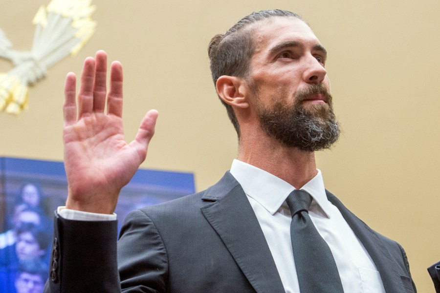 Michael Phelps, former Olympic athlete, is sworn in during a House Committee on Energy and Commerce Subcommittee on Oversight and Investigations hearing examining Anti-Doping Measures in Advance of the 2024 Olympics, on Capitol Hill, Tuesday, June 25, 2024, in Washington. (AP Photo/Rod Lamkey, Jr.)