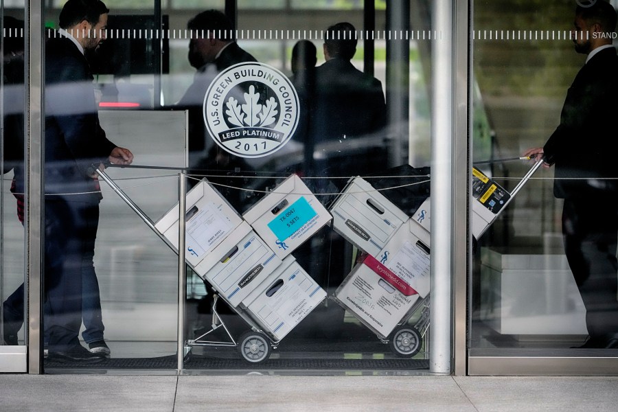 Case documents are wheeled into federal court Monday, June 17, 2024, in Los Angeles. NFL Commissioner Roger Goodell and Dallas Cowboys owner Jerry Jones, a longtime member of the league's broadcast committee, are expected to testify in a trial that could last up to three weeks. (AP Photo/Damian Dovarganes)