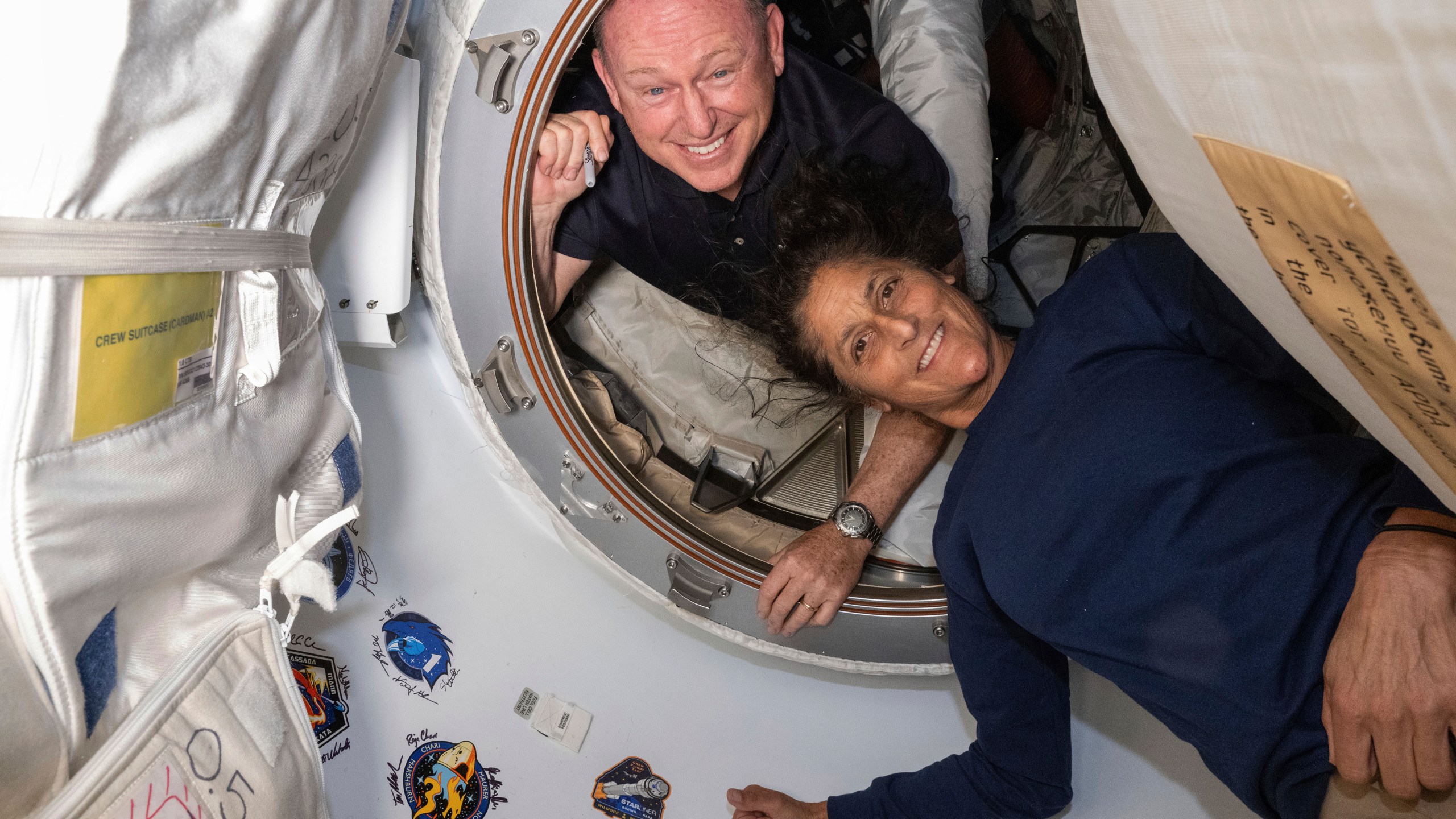 Boeing Crew Flight Test astronauts Butch Wilmore and Suni Williams pose for a portrait on the International Space Station