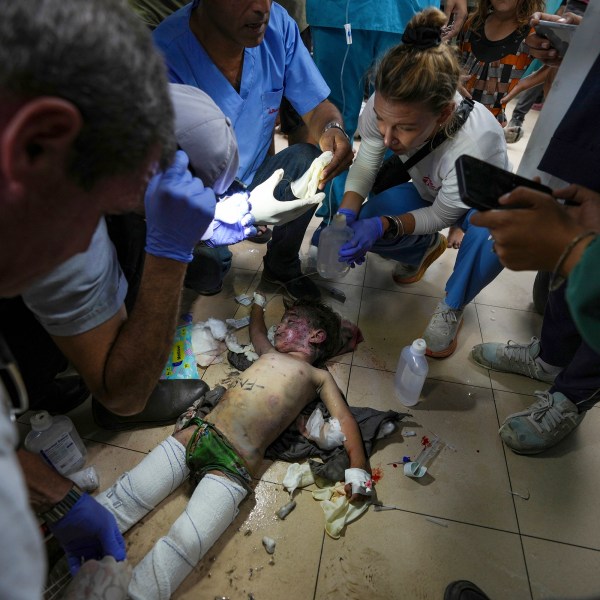 Medics treat a wounded child from an Israeli bombardment of Nuseirat refugee camp, at al-Aqsa Martyrs Hospital in Deir al Balah, central Gaza Strip, Saturday, June 29, 2024. (AP Photo/Abdel Kareem Hana)