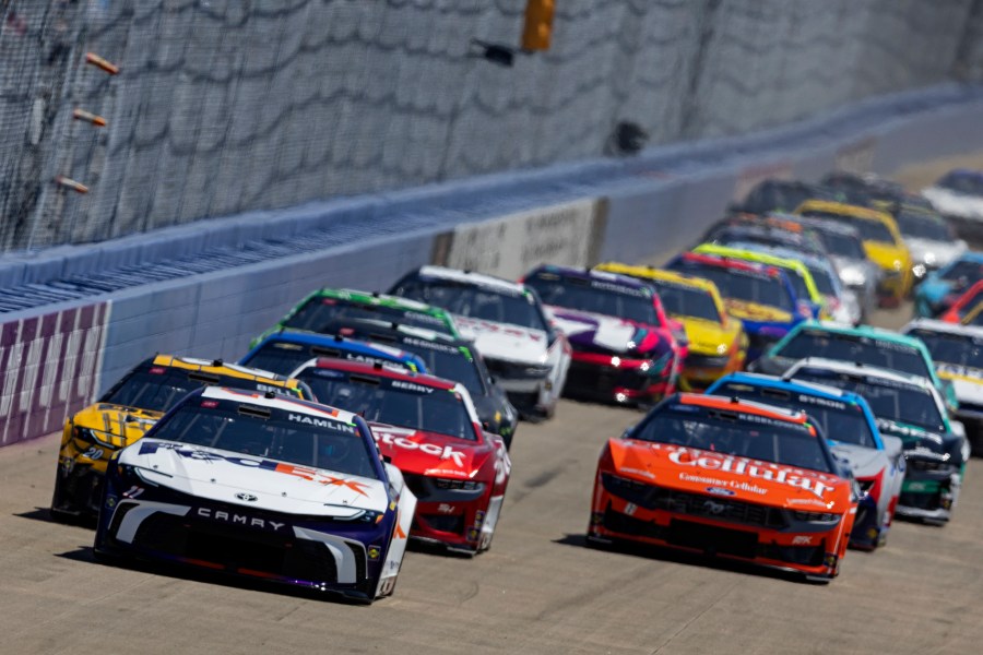 Denny Hamlin (11) leads the field to start a NASCAR Cup Series auto race, Sunday, June 30, 2024, in Gladeville, Tenn. (AP Photo/Wade Payne)