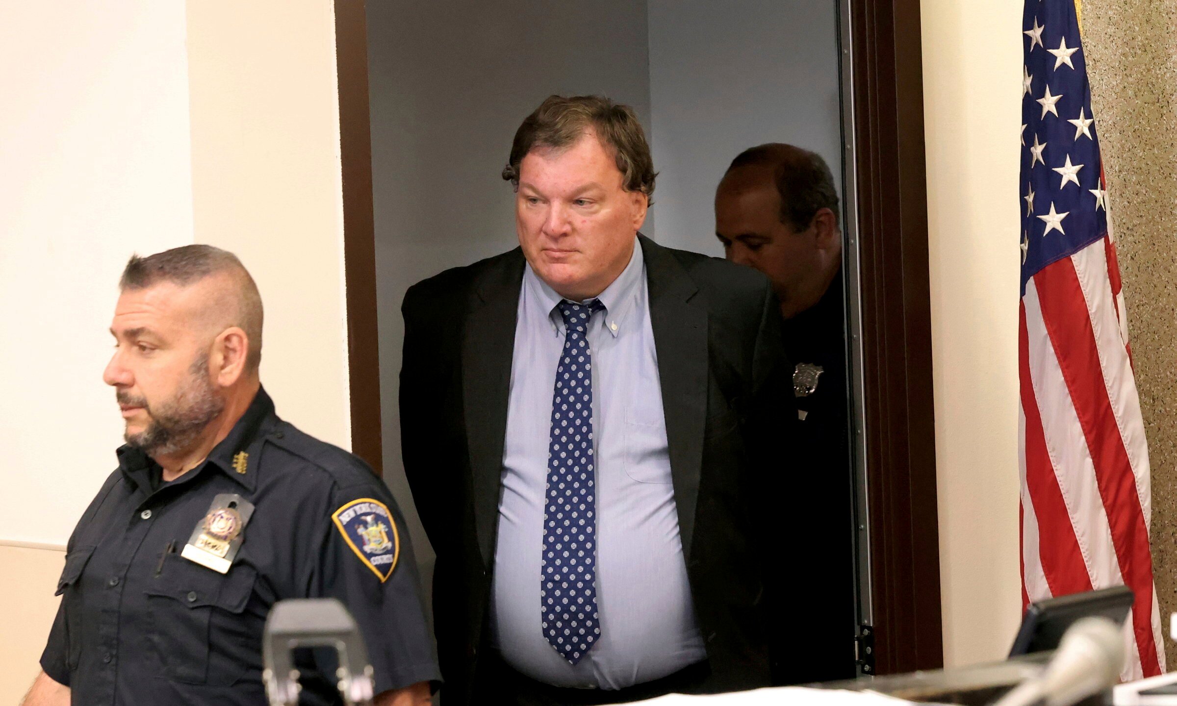 Rex Heuermann, center, charged in the Gilgo Beach killings, arrives in court June 6, 2024.