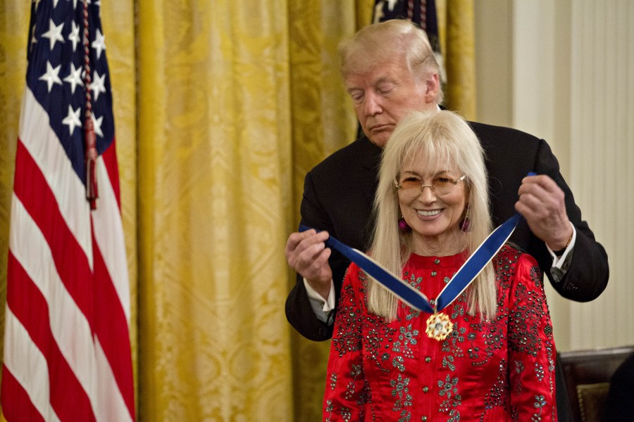 President Donald Trump, presents Miriam Adelson