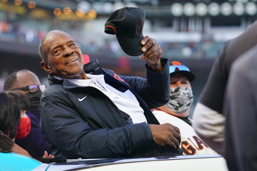 Hall of Famer Willie Mays waves to the crowd during the pre-game celebration in honor of his 90th birthday