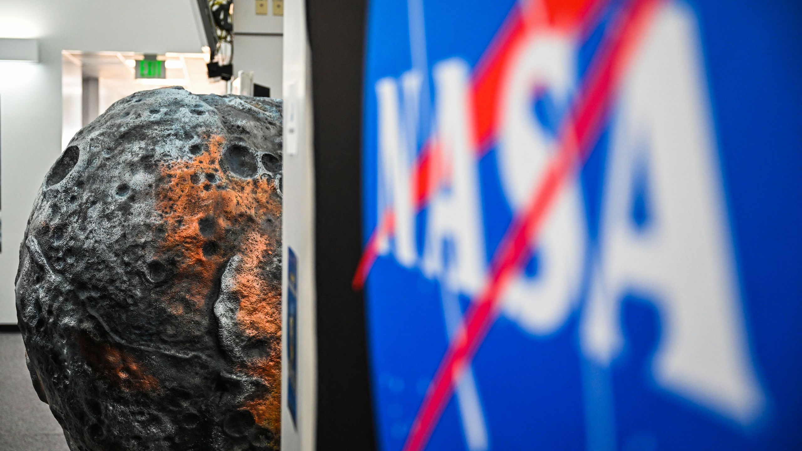 A model of the metal-rich asteroid named Psyche is displayed at the media center in NASA's Kennedy Space Center in Cape Canaveral, Florida