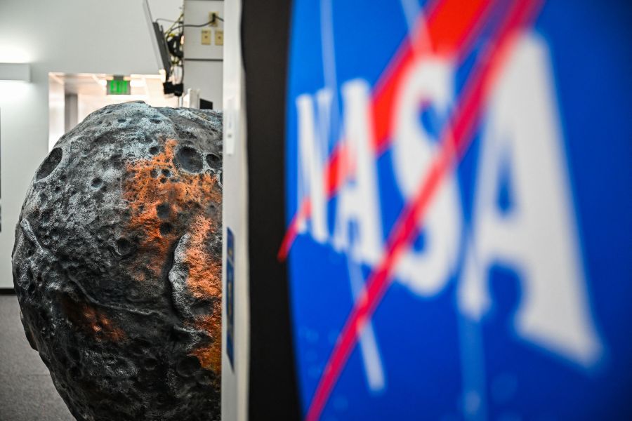 A model of the metal-rich asteroid named Psyche is displayed at the media center in NASA's Kennedy Space Center in Cape Canaveral, Florida