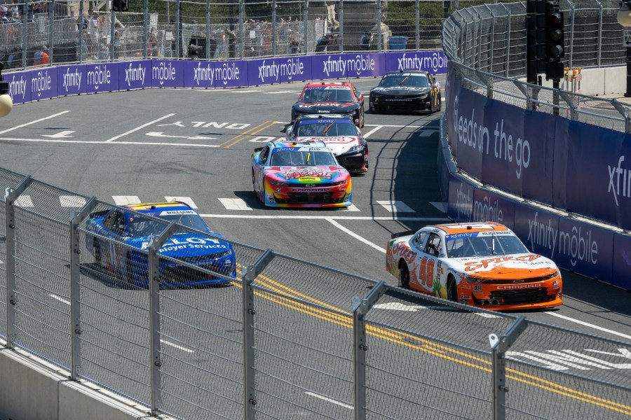 Cars navigate turn 19 during a NASCAR Xfinity Series street course auto race in Grant Park, Saturday, July 6, 202 4 in Chicago. (Tyler Pasciak LaRiviere/Chicago Sun-Times via AP)