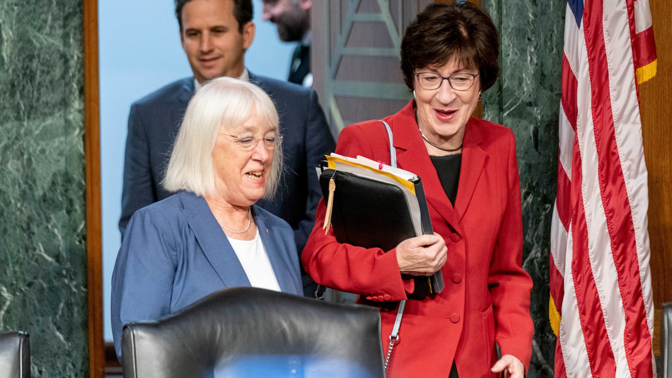 FILE - Chair Sen. Patty Murray, D-Wash., left, and Vice Chair Sen. Susan Collins, R-Maine, right, arrives for a Senate Appropriations hearing, on Capitol Hill in Washington, May 16, 2023. The Senate will pursue a spending increase next year of about 3.4% for defense and 2.7% increase for non-defense programs under a bipartisan agreement reached by the Senate Appropriations Committee. The deal reached by Sens. Patty Murray and Susan Collins sets up a certain clash later this year with the House, which is pursuing less spending in both categories. (AP Photo/Andrew Harnik, File)