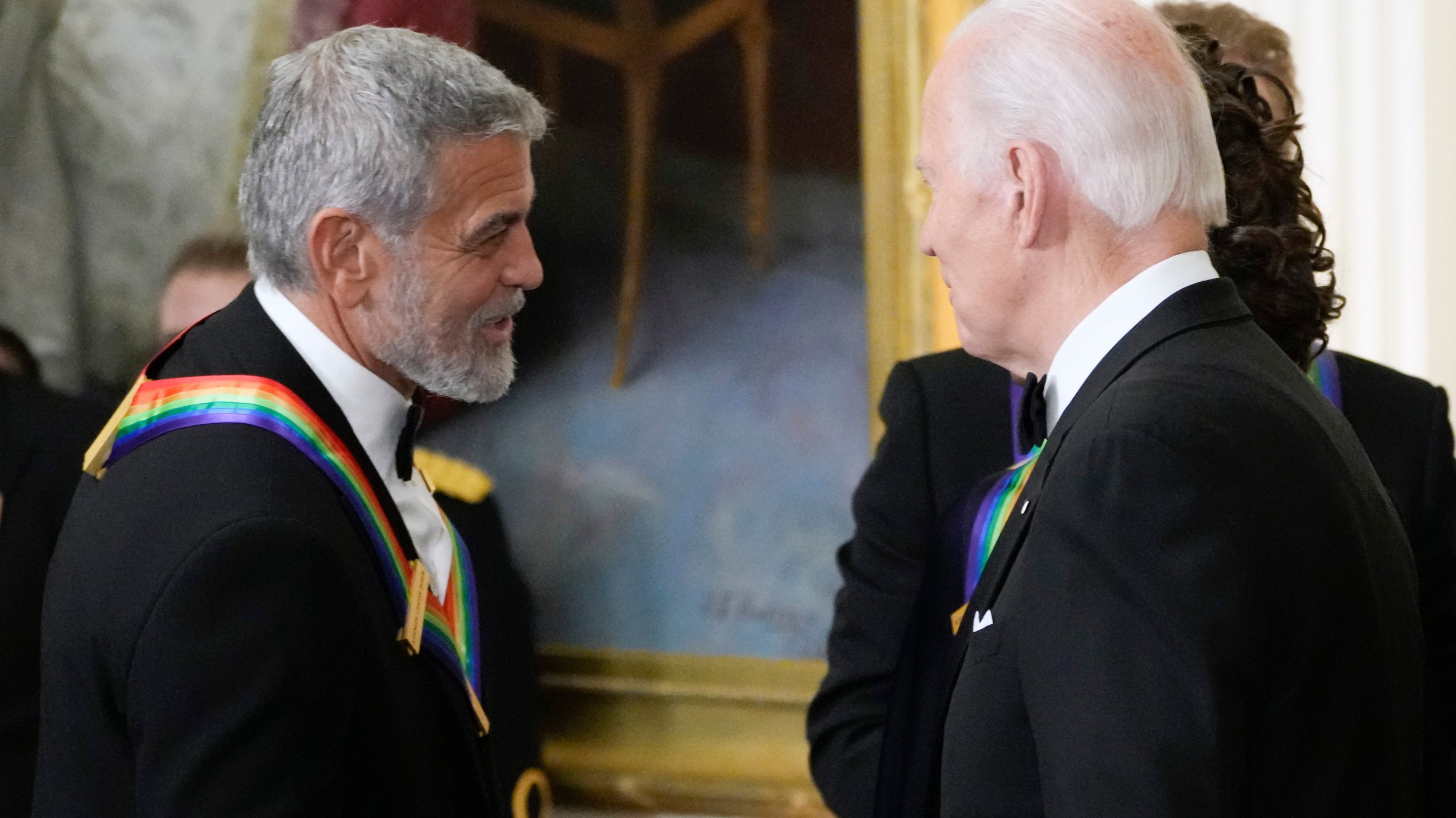 FILE - President Joe Biden shakes hands with actor, director and producer George Clooney during the Kennedy Center honorees reception at the White House in Washington, Dec. 4, 2022. Movie star and lifelong Democrat George Clooney is adding his voice to calls for Joe Biden to leave the presidential race. Clooney says in a New York Times opinion piece Wednesday that he loves Biden, but the party would lose the presidential race as well as any control in Congress with him as the nominee. (AP Photo/Manuel Balce Ceneta)