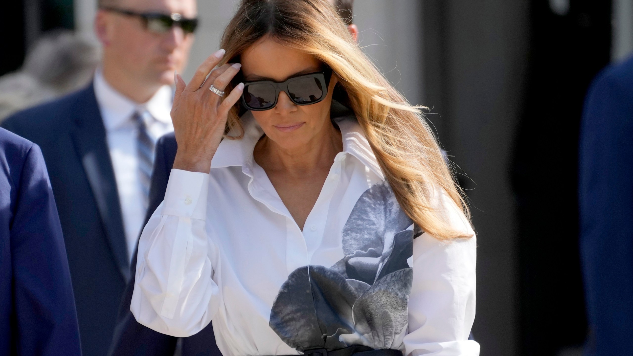 FILE - Former first lady Melania Trump leaves after voting in the Florida primary election in Palm Beach, Fla., March 19, 2024. Former first lady Melania Trump will attend the Republican National Convention next week in Milwaukee. That’s according to two people familiar with her plans who spoke on condition of anonymity before full details are released (AP Photo/Wilfredo Lee, File)