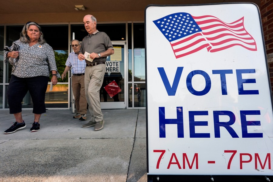 FILE - Voters depart an election center during primary voting, May 21, 2024, in Kennesaw, Ga. Conservative groups are systematically attempting to challenge large numbers of voter registrations across the country ahead of this year's presidential election. The strategy is part of a wider effort to raise questions about the integrity of this year's election as former President Donald Trump repeatedly claims without evidence that his opponents are trying to cheat. (AP Photo/Mike Stewart, File)