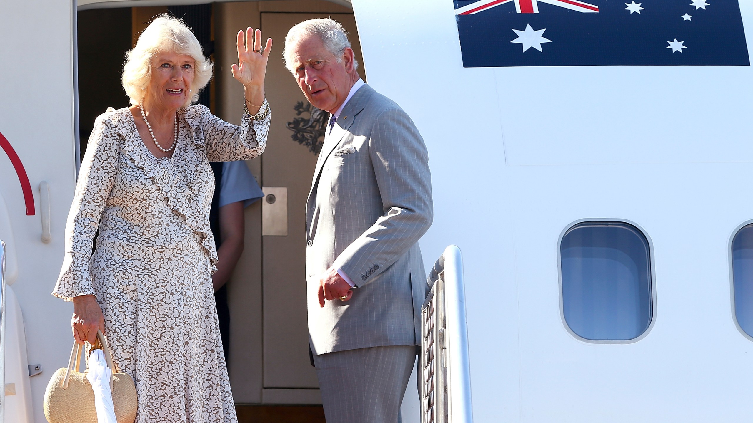 FILE - Britain's Prince Charles, right, and his wife Camilla, Duchess of Cornwall, wave as they prepare to depart Perth, Australia, Sunday, Nov. 15, 2015. King Charles III is preparing to visit Australia and Samoa in October 2024, an itinerary that will span 12 time zones and test the monarch’s stamina as he recovers from cancer treatment. The trip was announced on Sunday, July 14, 2024, by Buckingham Palace. (Paul Kane/Pool via AP, File )