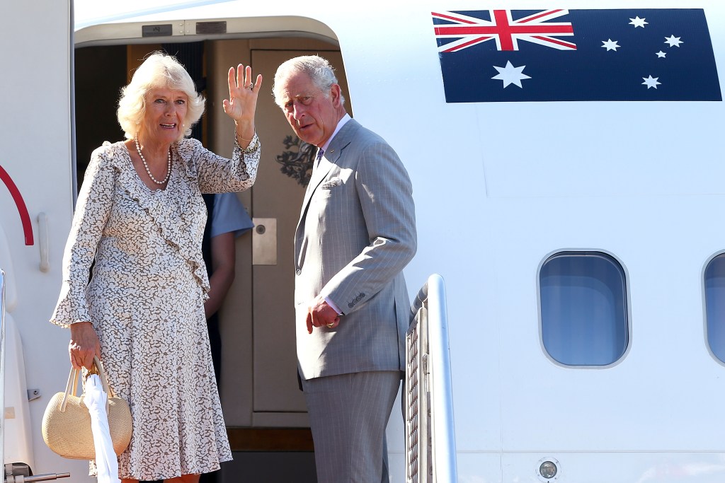 FILE - Britain's Prince Charles, right, and his wife Camilla, Duchess of Cornwall, wave as they prepare to depart Perth, Australia, Sunday, Nov. 15, 2015. King Charles III is preparing to visit Australia and Samoa in October 2024, an itinerary that will span 12 time zones and test the monarch’s stamina as he recovers from cancer treatment. The trip was announced on Sunday, July 14, 2024, by Buckingham Palace. (Paul Kane/Pool via AP, File )