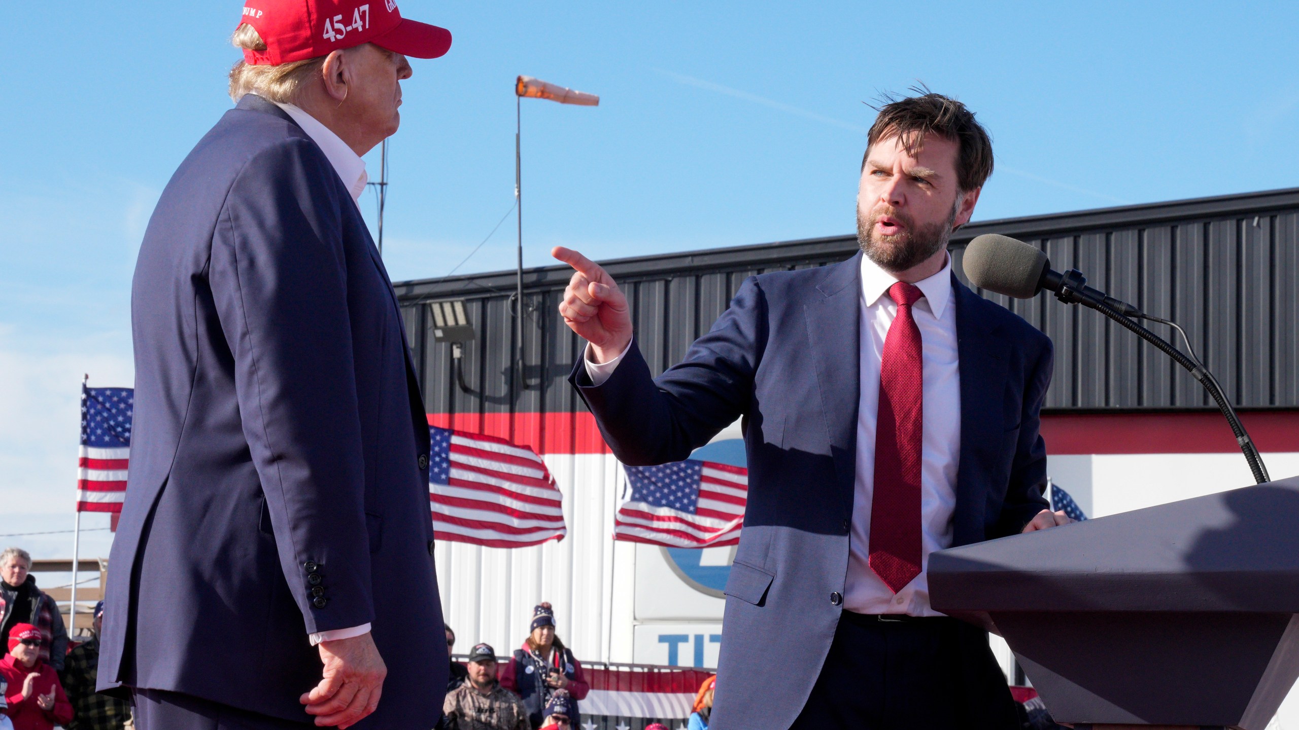 FILE - Sen. J.D. Vance, R-Ohio, right, points toward Republican presidential candidate former President Donald Trump at a campaign rally, March 16, 2024, in Vandalia, Ohio. Trump says Ohio Sen. JD Vance will be his vice presidential pick. He says on his Truth Social Network that, “After lengthy deliberation and thought, and considering the tremendous talents of many others, I have decided that the person best suited to assume the position of Vice President of the United States is Senator J.D. Vance of the Great State of Ohio.” (AP Photo/Jeff Dean, File)