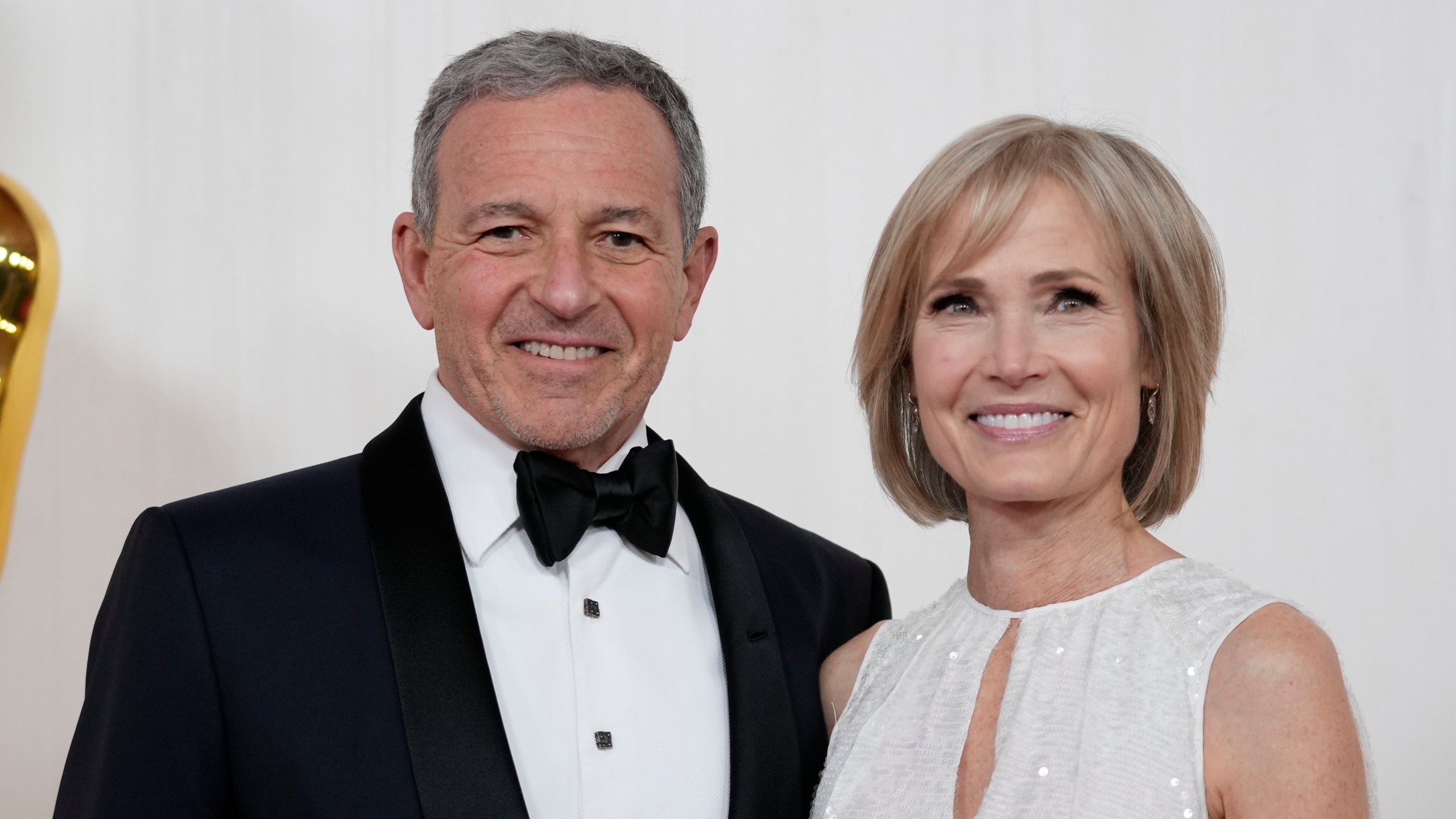 FILE - Bob Iger, left, and Willow Bay arrive at the Oscars on Sunday, March 10, 2024, at the Dolby Theatre in Los Angeles. Angel City FC announced Wednesday, July 17, 2024, that Walt Disney Company CEO Bob Iger and Southern California dean for communication and journalism Willow Bay will be the new controlling owners of what the franchise calls the most valuable women’s sports team in the world. (AP Photo/Ashley Landis, File)