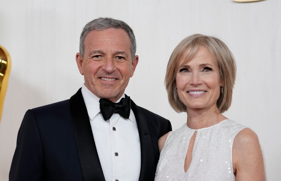 FILE - Bob Iger, left, and Willow Bay arrive at the Oscars on Sunday, March 10, 2024, at the Dolby Theatre in Los Angeles. Angel City FC announced Wednesday, July 17, 2024, that Walt Disney Company CEO Bob Iger and Southern California dean for communication and journalism Willow Bay will be the new controlling owners of what the franchise calls the most valuable women’s sports team in the world. (AP Photo/Ashley Landis, File)