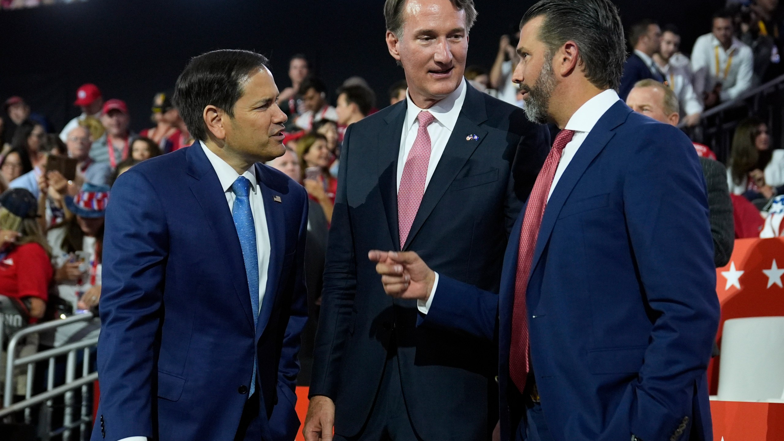 Sen. Marco Rubio, R-Fla.,, Virginia Gov. Glenn Youngkin and Donald Trump Jr., talk on third day of the Republican National Convention at the Fiserv Forum, Wednesday, July 17, 2024, in Milwaukee. (AP Photo/Evan Vucci)