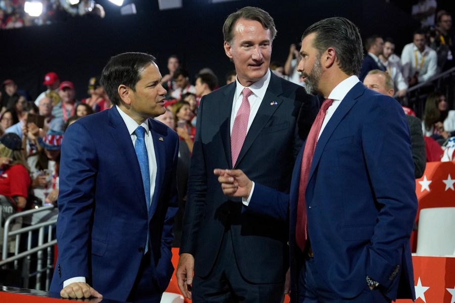 Sen. Marco Rubio, R-Fla.,, Virginia Gov. Glenn Youngkin and Donald Trump Jr., talk on third day of the Republican National Convention at the Fiserv Forum, Wednesday, July 17, 2024, in Milwaukee. (AP Photo/Evan Vucci)