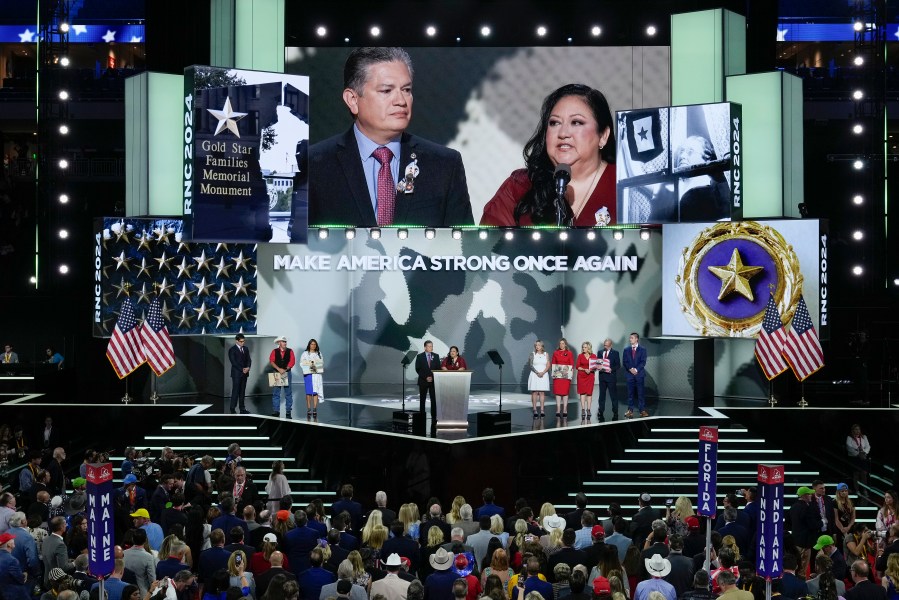 Herman Lopez, left, Alicia Lopez, right, and other Gold Star family members on stage during the Republican National Convention on Wednesday, July 17, 2024, in Milwaukee. (AP Photo/J. Scott Applewhite)