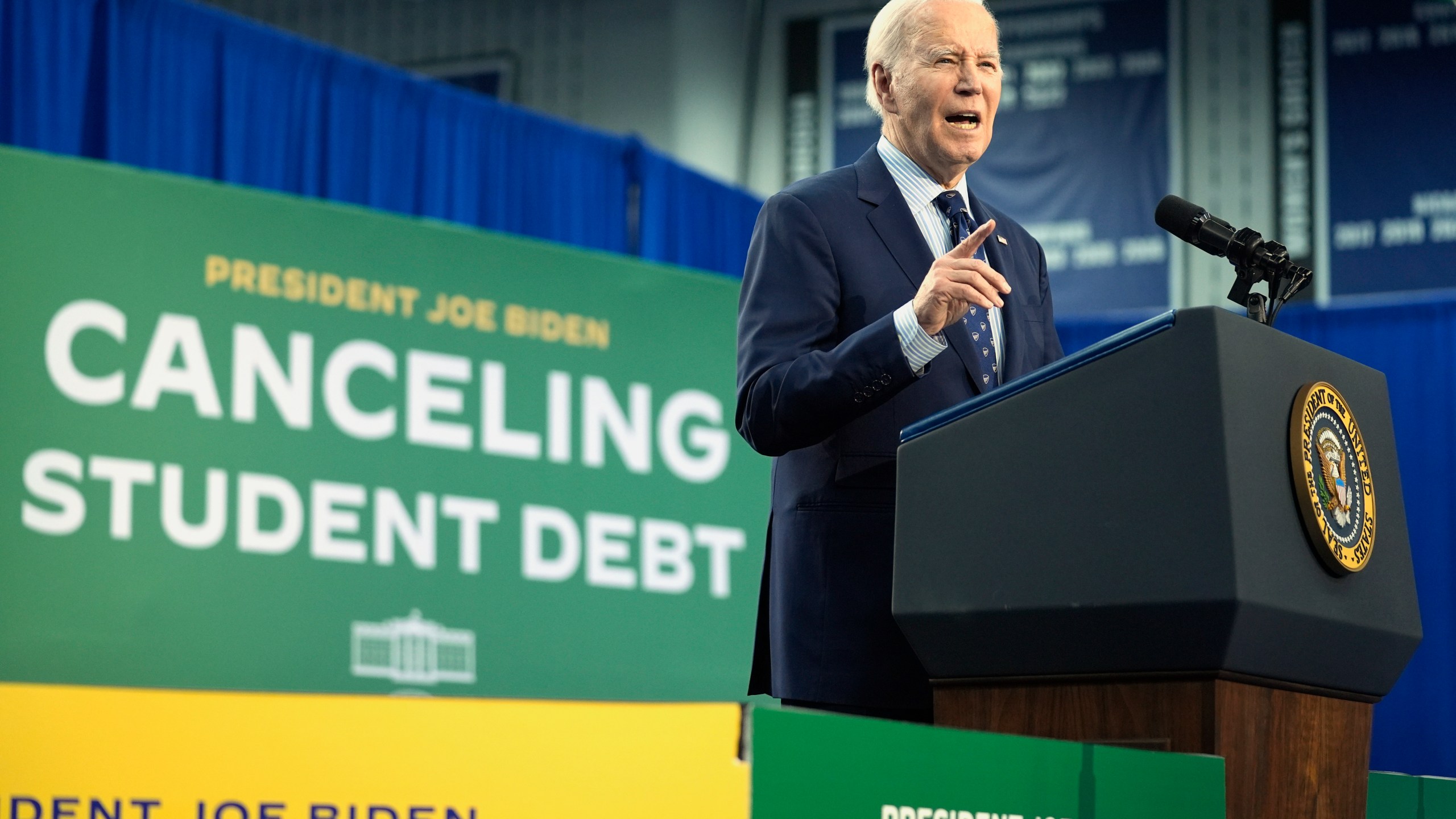 FILE - President Joe Biden speaks about student loan debt, April 8, 2024, in Madison, Wis. A federal appeals court has blocked the implementation of the Biden administration's student debt relief plan, which would have lowered monthly payments for millions of borrowers. In a ruling Thursday, July 18, the 8th Circuit Court of Appeals granted a request by a group of Republican-led states seeking to invalidate the administration's entire loan forgiveness program. (AP Photo/Evan Vucci, File)