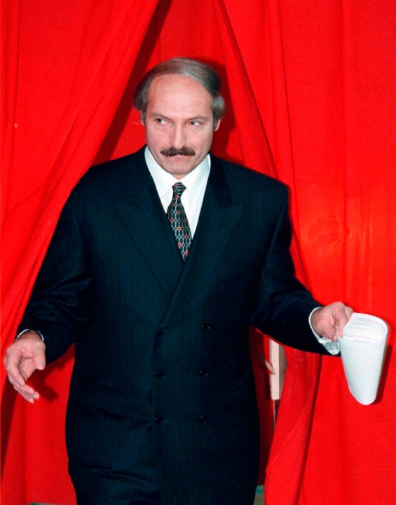 FILE - President Alexander Lukashenko of Belarus emerges from a polling booth after voting in a national referendum in Minsk, Belarus, on Nov. 24, 1996. Lukashenko, who marks 30 years in power on Saturday, is one of the world's longest-serving and most ruthless leaders. (AP Photo, File)