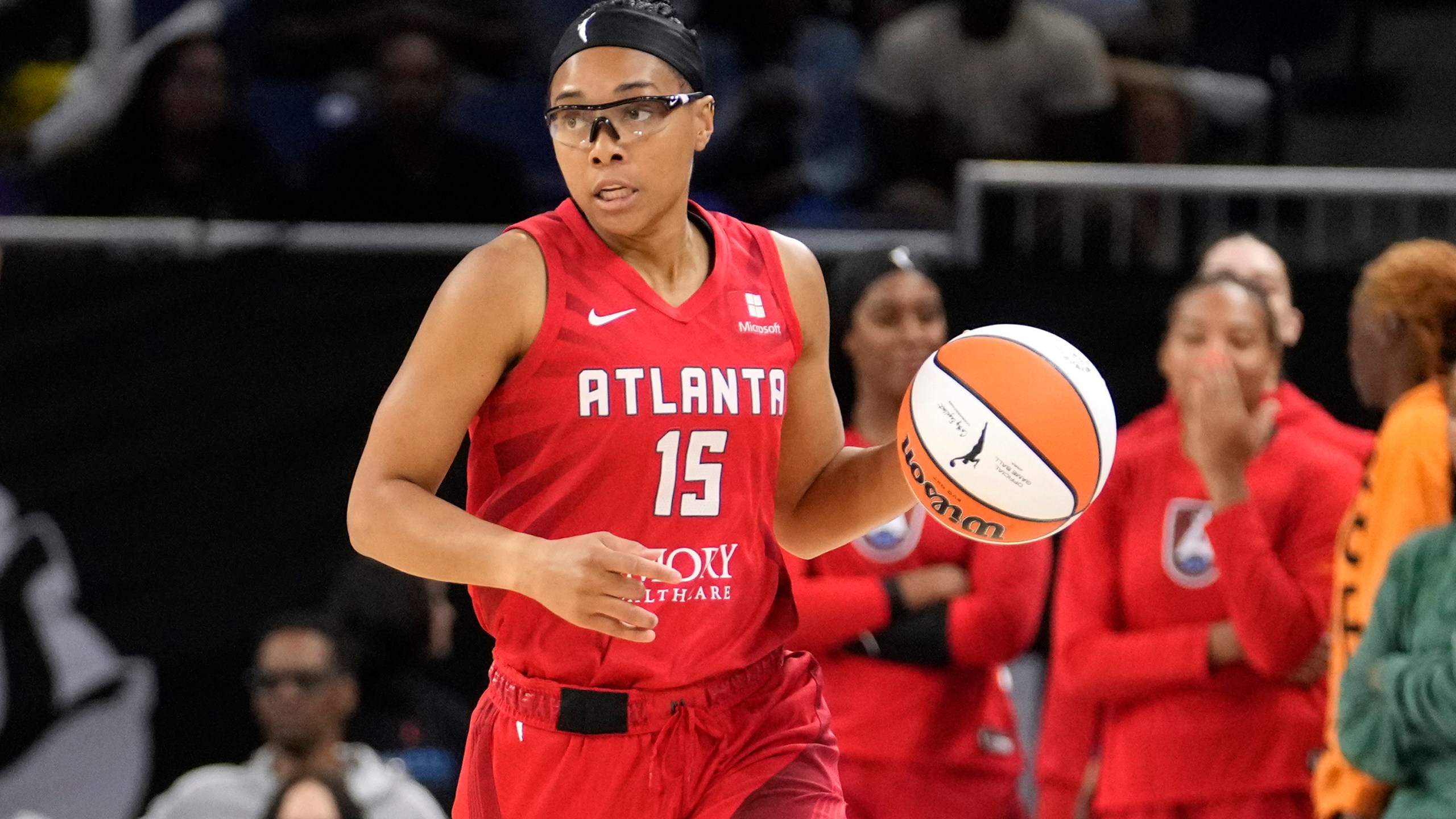 FILE - Atlanta Dream's Allisha Gray advances the ball during a WNBA basketball game against the Chicago Sky on Wednesday, July 10, 2024, in Chicago. Gray became the first player in WNBA history to win both the 3-point and skills competition in the same year, capturing both titles Friday, July 19.(AP Photo/Charles Rex Arbogast, File)