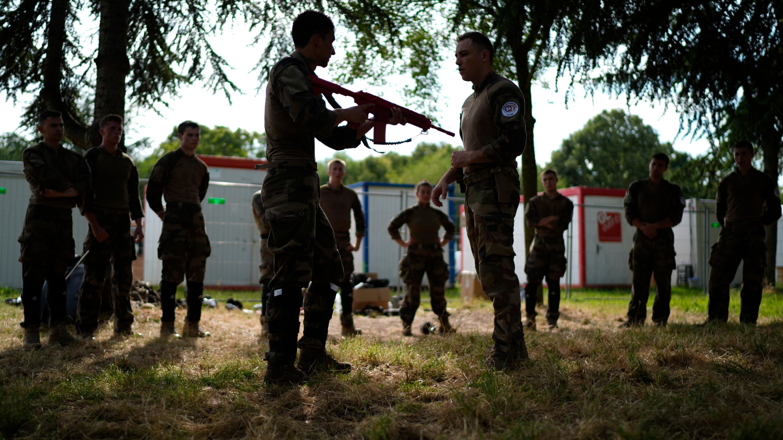 Soldiers demonstrate operational technics for close combat in a training class at a military camp set up for the Paris Olympic games Friday, July 19, 2024, Vincennes, just outside Paris, France. (AP Photo/David Goldman)