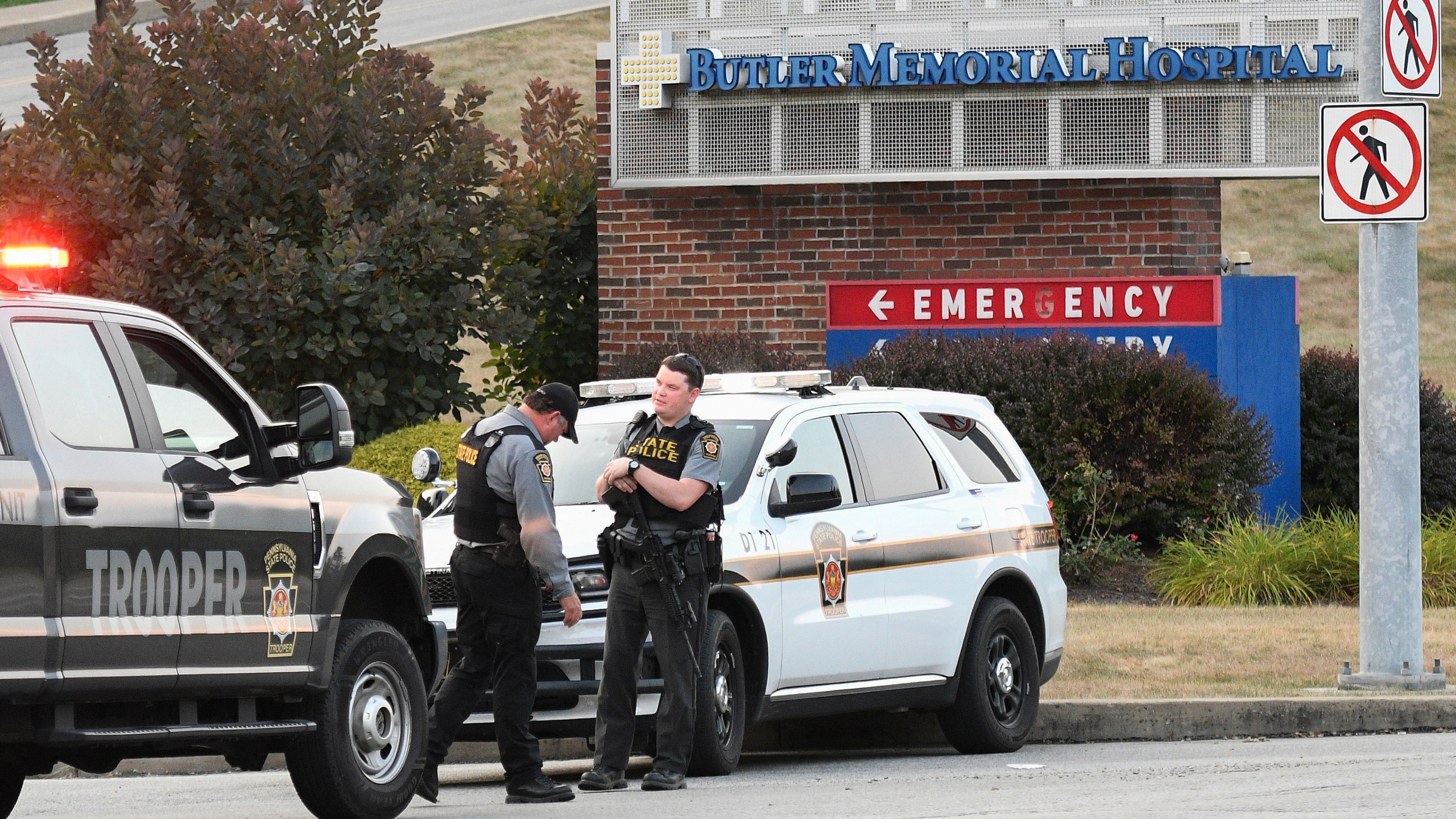 Pennsylvania State Troopers guard the entrance to Butler Memorial Hospital, Saturday, July 13, 2024, where Republican presidential candidate former President Donald Trump was said to be taken after shots were fired at a campaign rally in Butler, Pa. (AP Photo/Don Wright)